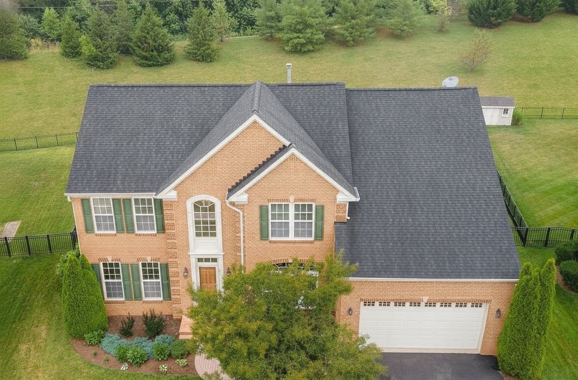 The same colonial home after renewal, the roof clean, sealed and protected